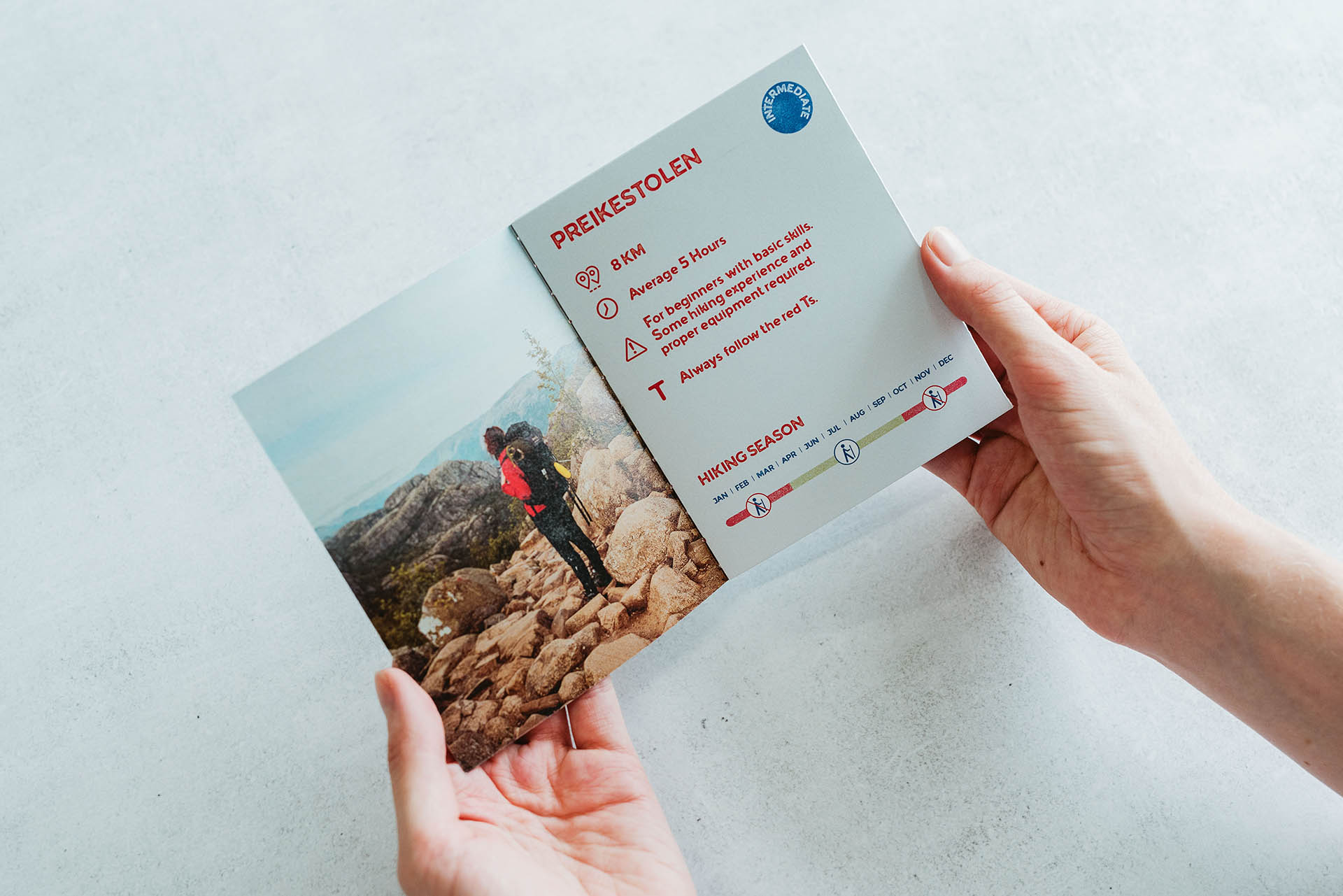 Page spread design featuring important information about the hike to Preikestolen
